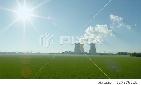 Nuclear power plant nestled in nature. Cooling towers emit steam plumes, contrasting industrial might with serene surroundings 127876319