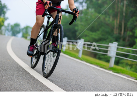 Asian woman cycling at summer park 127876815
