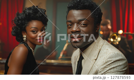 well dressed pianist in white tuxedo accompanies stunning jazz singer in black silk dress during elegant performance surrounded rich velvet curtains 127878593