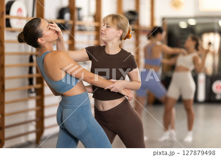 Young women in self-defense training 127879498