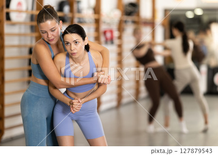 Young women in self-defense training 127879543