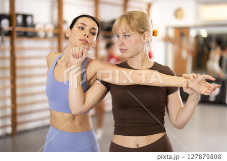 Women training self-defense technicians Women training self-defense technicians 127879808