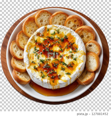 Delicious Baked Camembert with Honey Drizzle and Fresh Thyme Garnish Served with Crispy Bread Slices 127881452
