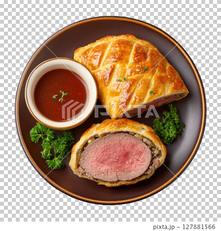Delicious Beef Wellington with Tender Fillet and Golden Puff Pastry Served with Sauce on a Plate Delicious Beef Wellington with Tender Fillet and Golden Puff Pastry Served with Sauce on a Plate 127881566