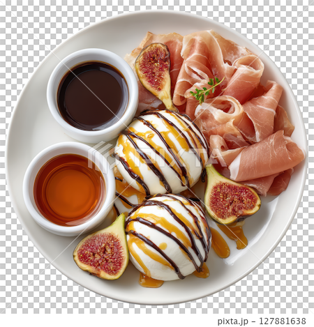 Creamy Burrata Cheese with Prosciutto di Parma and Roasted Figs on a Plate with Drizzle and Sauces 127881638