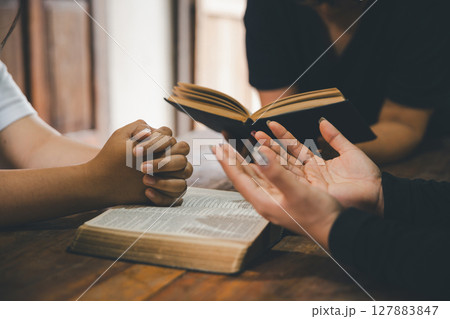 Praying religion, worship and group of people pray to God, Family, holding hands and prayer in home for love, support and faith or hope in house. holy spirit or Jesus for peace or spiritual praise. Praying religion, worship and group of people pray to God, Family, holding hands and prayer in home for love, support and faith or hope in house. holy spirit or Jesus for peace or spiritual praise. 127883847