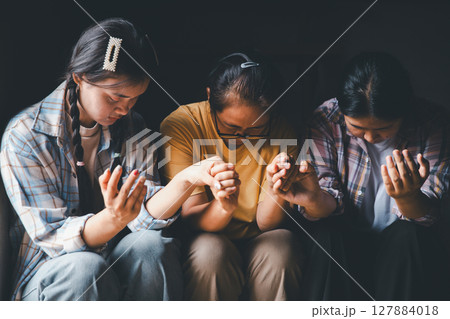 Close up group christians hands pray to God with spiritual faith on holy bible in catholic church. religion worship prayer ask god bless grace jesus believe. Christianity religion prayer holy worship Close up group christians hands pray to God with spiritual faith on holy bible in catholic church. religion worship prayer ask god bless grace jesus believe. Christianity religion prayer holy worship 127884018