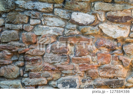 Backgrounds of the old stone wall. 127884386
