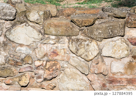 Backgrounds of the old stone wall. 127884395