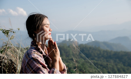 Grateful woman having HOPE praying to God. Spiritual girl smiling to sky. Happy female being thankful. Spiritual girl praying with hope. Positive asian young woman feeling hope and faith looking up. Grateful woman having HOPE praying to God. Spiritual girl smiling to sky. Happy female being thankful. Spiritual girl praying with hope. Positive asian young woman feeling hope and faith looking up. 127884827
