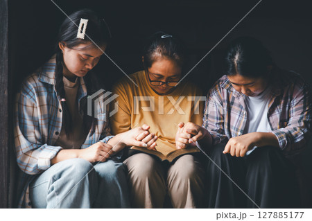Close up group christians hands pray to God with spiritual faith on holy bible in catholic church. religion worship prayer ask god bless grace jesus believe. Christianity religion prayer holy worship Close up group christians hands pray to God with spiritual faith on holy bible in catholic church. religion worship prayer ask god bless grace jesus believe. Christianity religion prayer holy worship 127885177