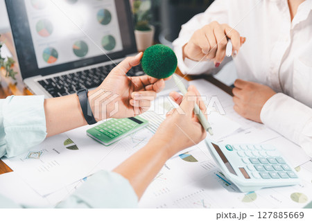 Business people working on sustainable innovation project. renewable energy concept. Teamwork Meeting, partner on model building company office technology, based green businesses and global warming. Business people working on sustainable innovation project. renewable energy concept. Teamwork Meeting, partner on model building company office technology, based green businesses and global warming. 127885669