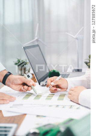 Business people working on sustainable innovation project. renewable energy concept. Teamwork Meeting, partner on model building company office technology, based green businesses and global warming. 127885672