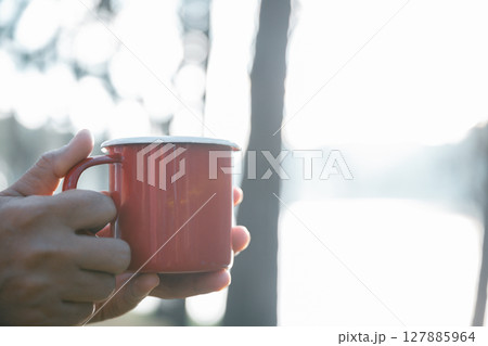 Business concept of cafe focuses on nurturing coffee in harmony with nature, organic seed create warm cup caffeine, background green fresh great outdoor. aromatic drink, rich aroma of rising from mug 127885964