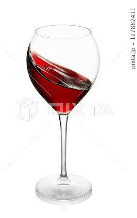 Red wine splashing inside the glass isolated on white background with clipping path Red wine splashing inside the glass isolated on white background with clipping path 127887411