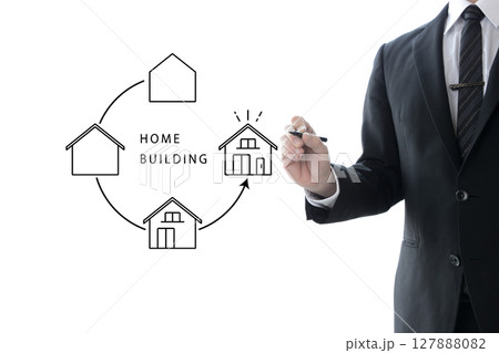 マイホームが少しずつ完成していく様子を描くスーツを着た男性 127888082