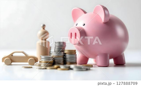 Piggy bank with coins on a white background, symbolizing savings and financial security in insurance planning 127888709