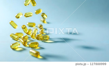 Yellow pills tumble from the air, embodying the pharmacy concept and highlighting the significance of medications 127888999