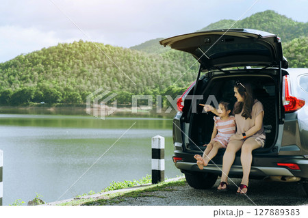 Summer vacation happy mother and daughter having fun. The concept of family on vacation and travel. Summer vacation happy mother and daughter having fun. The concept of family on vacation and travel. 127889383
