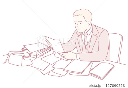 An office worker is reviewing important documents at their desk, ensuring accuracy An office worker is reviewing important documents at their desk, ensuring accuracy 127890228