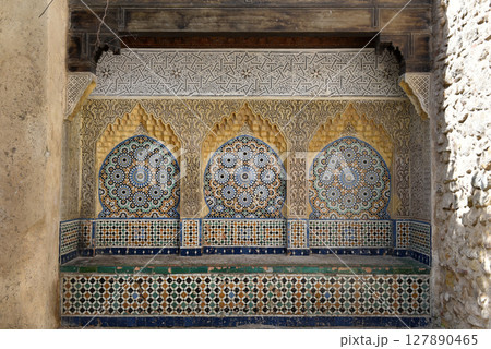 Ornamental and colorful arabesque carvings, mosaic tiles, zellige, medina of Tangier, Morocco Ornamental and colorful arabesque carvings, mosaic tiles, zellige, medina of Tangier, Morocco 127890465
