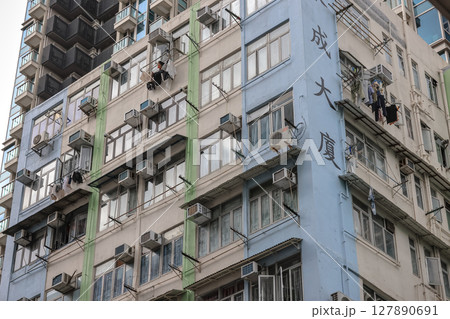 June 29 2025 Urban Apartment Exterior with Peeling Paint and Multiple Small Windows June 29 2025 Urban Apartment Exterior with Peeling Paint and Multiple Small Windows 127890691
