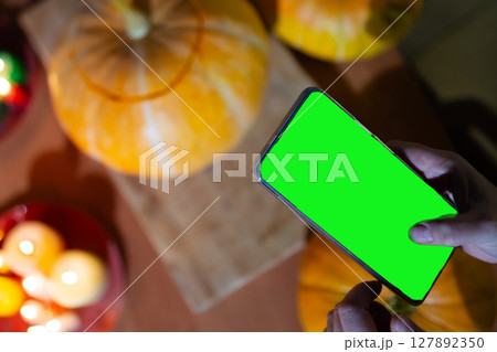 Halloween Celebration With Pumpkins and a Smartphone Ready for Fun Activities 127892350