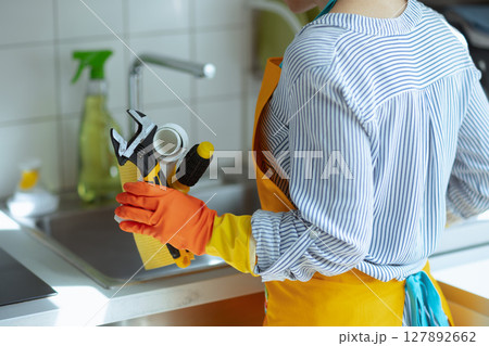 Woman Ready for Kitchen Plumbing Repair Woman Ready for Kitchen Plumbing Repair 127892662