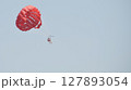 parasailing with red parachute 127893054