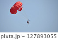 parasailing with red parachute 127893055