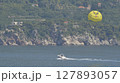 parasailing with yellow parachute 127893057