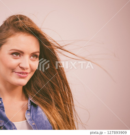 Joyful fashionable woman in denim shirt 127893909