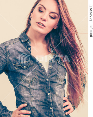 Fashionable woman with blowing hair 127893911