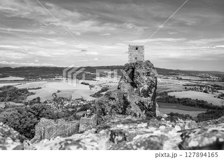 Trosky Castle ruins stand atop a rocky formation, offering a stunning view of the surrounding countryside in Bohemian Paradise, Czechia. 127894165