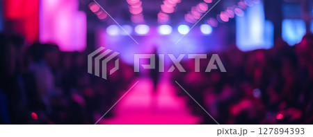 Blurry Fashion Show Runway with Model and Bokeh Lights 127894393