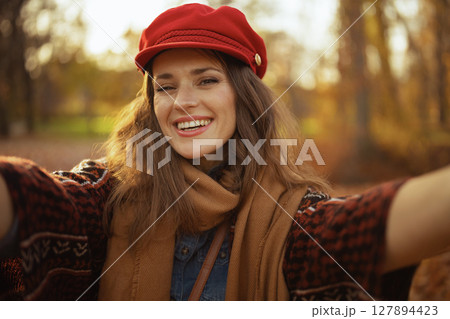 Portrait of smiling elegant woman having web cam meeting 127894423