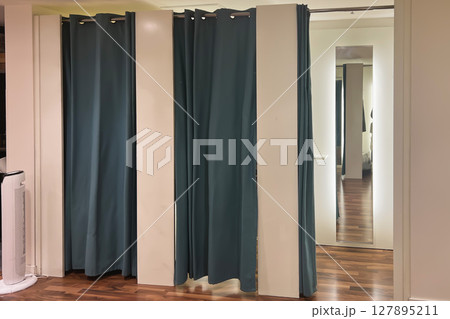A row of dressing booths for trying on clothes 127895211