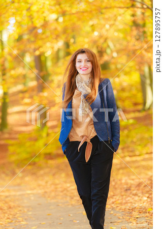 Young woman relaxing in park Young woman relaxing in park 127895757