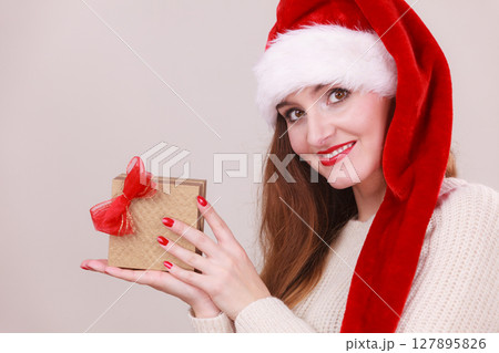 Woman holding gift box. Christmas time Woman holding gift box. Christmas time 127895826