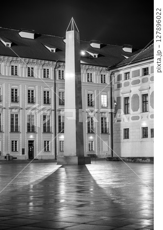 The Mrakotin Monolith stands tall in the courtyard of Prague Castle, beautifully illuminated by street lamps. The Mrakotin Monolith stands tall in the courtyard of Prague Castle, beautifully illuminated by street lamps. 127896022