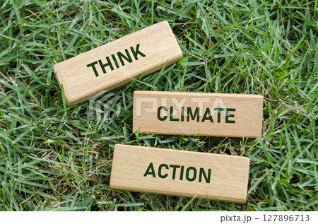 Climate Action text on wooden blocks, serving as a direct call to take urgent steps for the planet. Activism and awareness concept 127896713