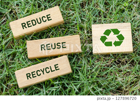Reduce Reuse Recycle text on wooden blocks with recycle icon, reinforcing sustainable habits for a cleaner future. Green lifestyle concept 127896720