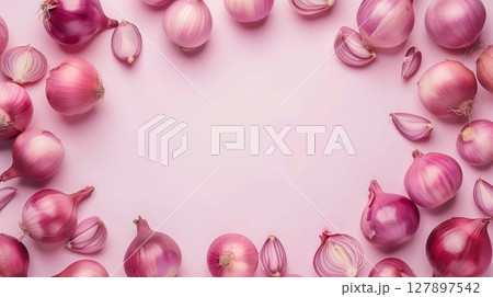 Onion organic fresh vegetable seasoning copy space in middle and pink background 127897542