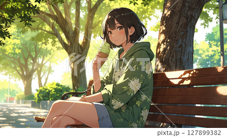 公園のベンチに座る女性 127899382