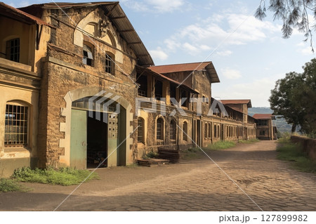 Old iron foundry building with large doors and windows is showing the industrial heritage of a bygone era in ethiopia 127899982