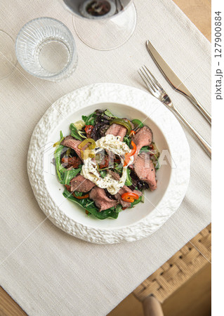Roast beef salad with stracciatella and tomatoes Roast beef salad with stracciatella and tomatoes 127900884