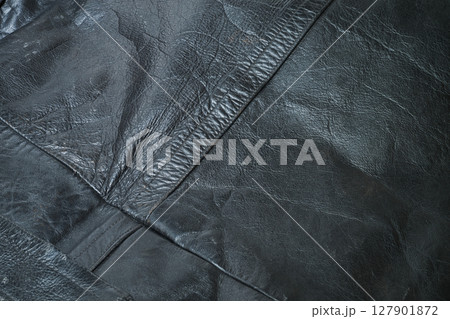 Old and aged black leather perfectoin 127901872