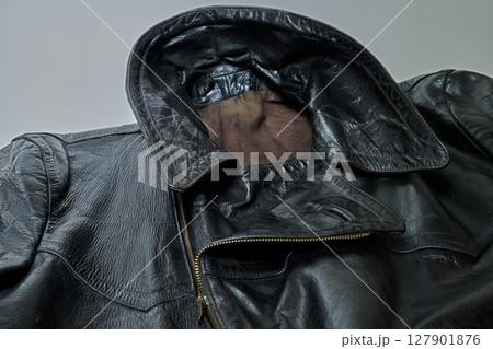 Old and aged black leather perfectoin 127901876