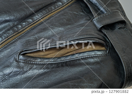 Old and aged black leather perfectoin Old and aged black leather perfectoin 127901882