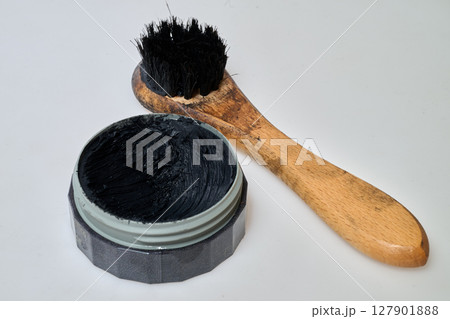 black shoe polish and brush black shoe polish and brush 127901888
